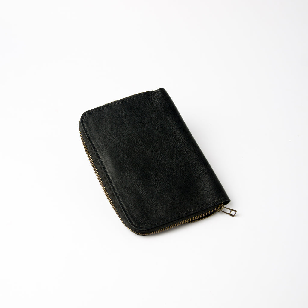 Lionell fully zippered black leather notebook cover. Handmade secure design with premium finish.