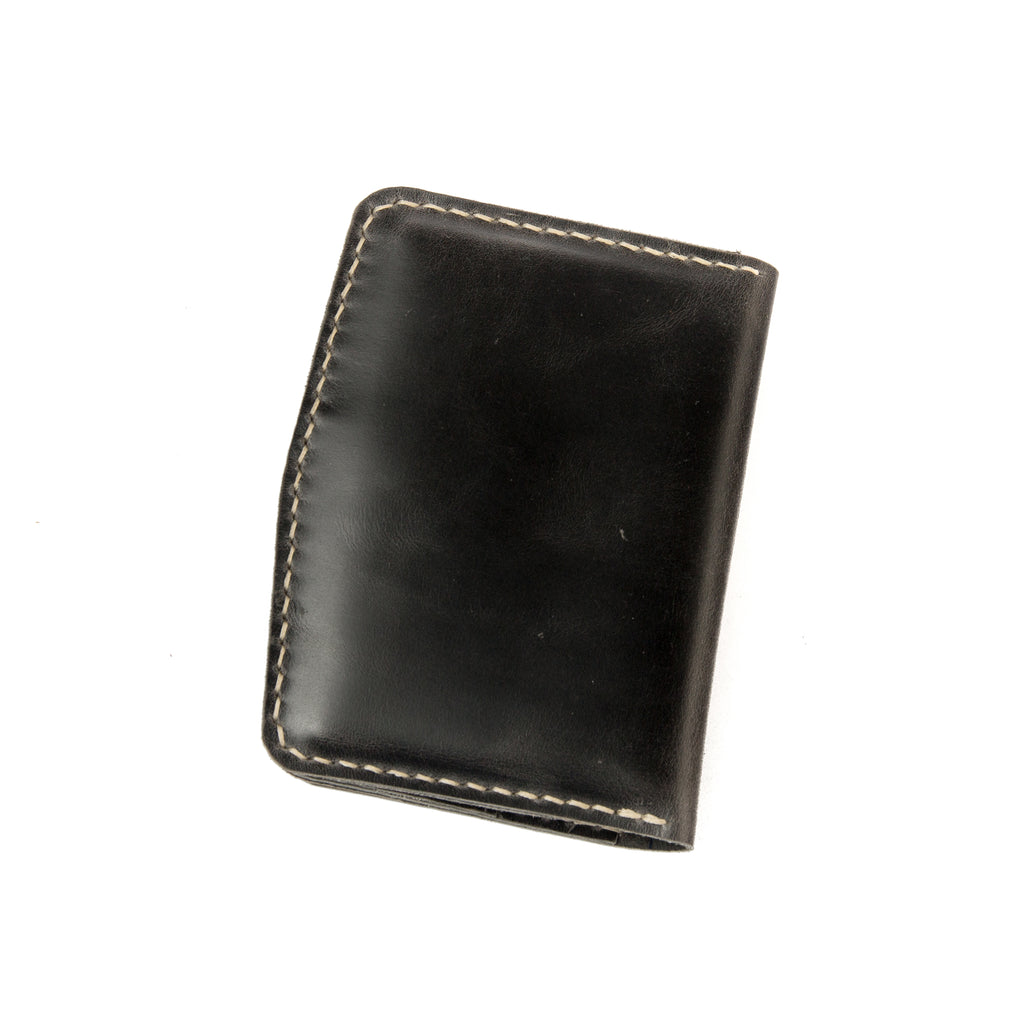 Closed view of Lionell handmade vintage leather passport holder in black