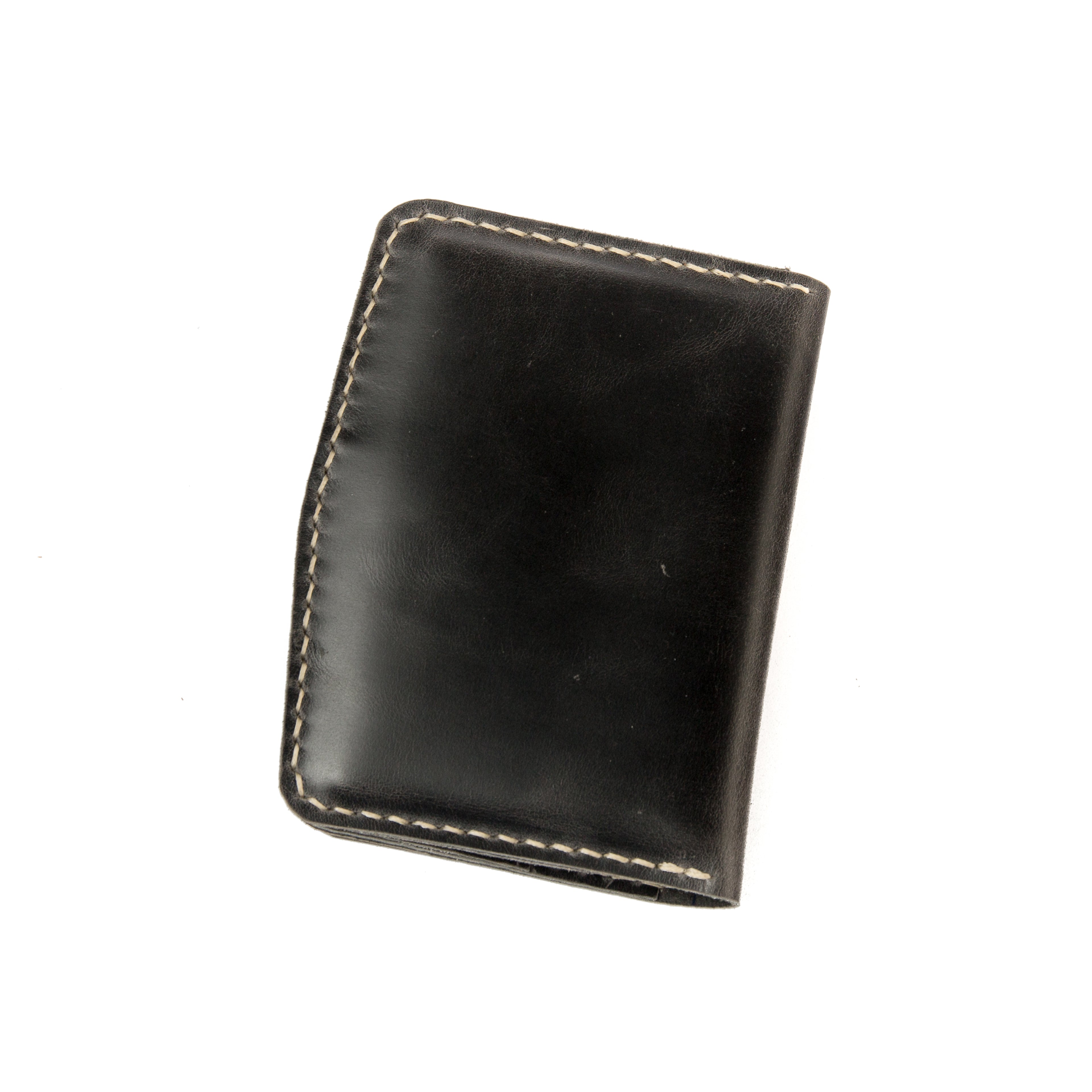 Closed view of Lionell handmade vintage leather passport holder in black