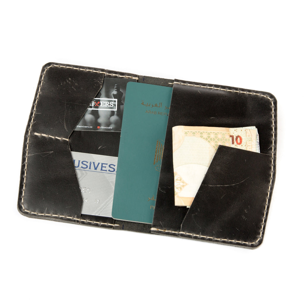 Open view of Lionell handmade vintage leather passport holder in black