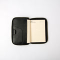 Front view of black refillable leather journal cover with zipper and card slots - Lionell.