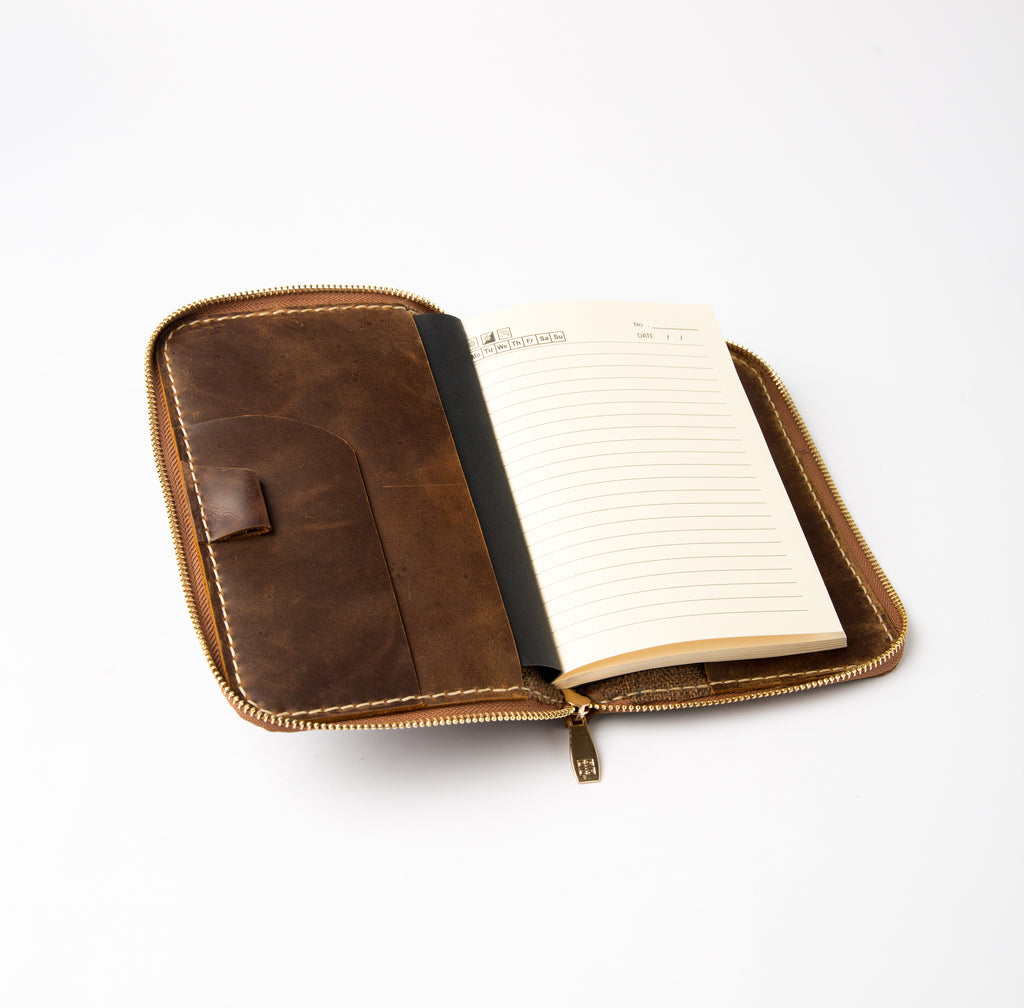 Open view of dark brown refillable leather journal cover with zipper and card slots - Lionell.