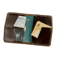 Open view of Lionell handmade vintage leather passport holder in espresso