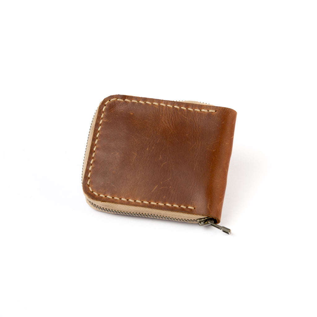 Lionell fully zippered leather wallet. Durable handmade Egyptian craftsmanship with safe design closed view.