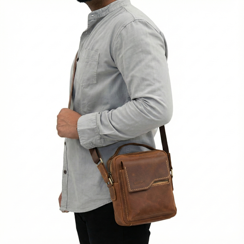 Man wearing Lionell vintage brown leather crossbody bag. Stylish handmade design for daily use.