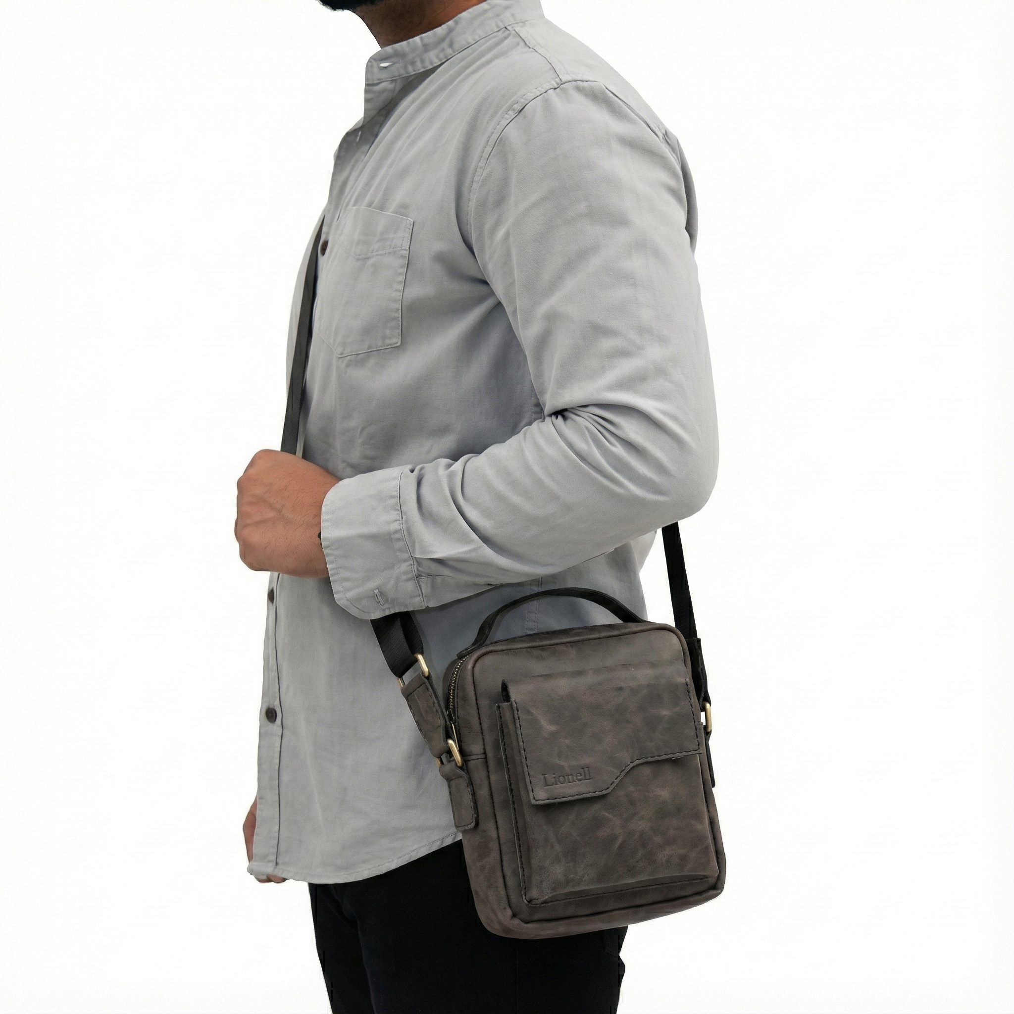 Man wearing Lionell vintage grey leather crossbody bag. Stylish handmade design for daily use.
