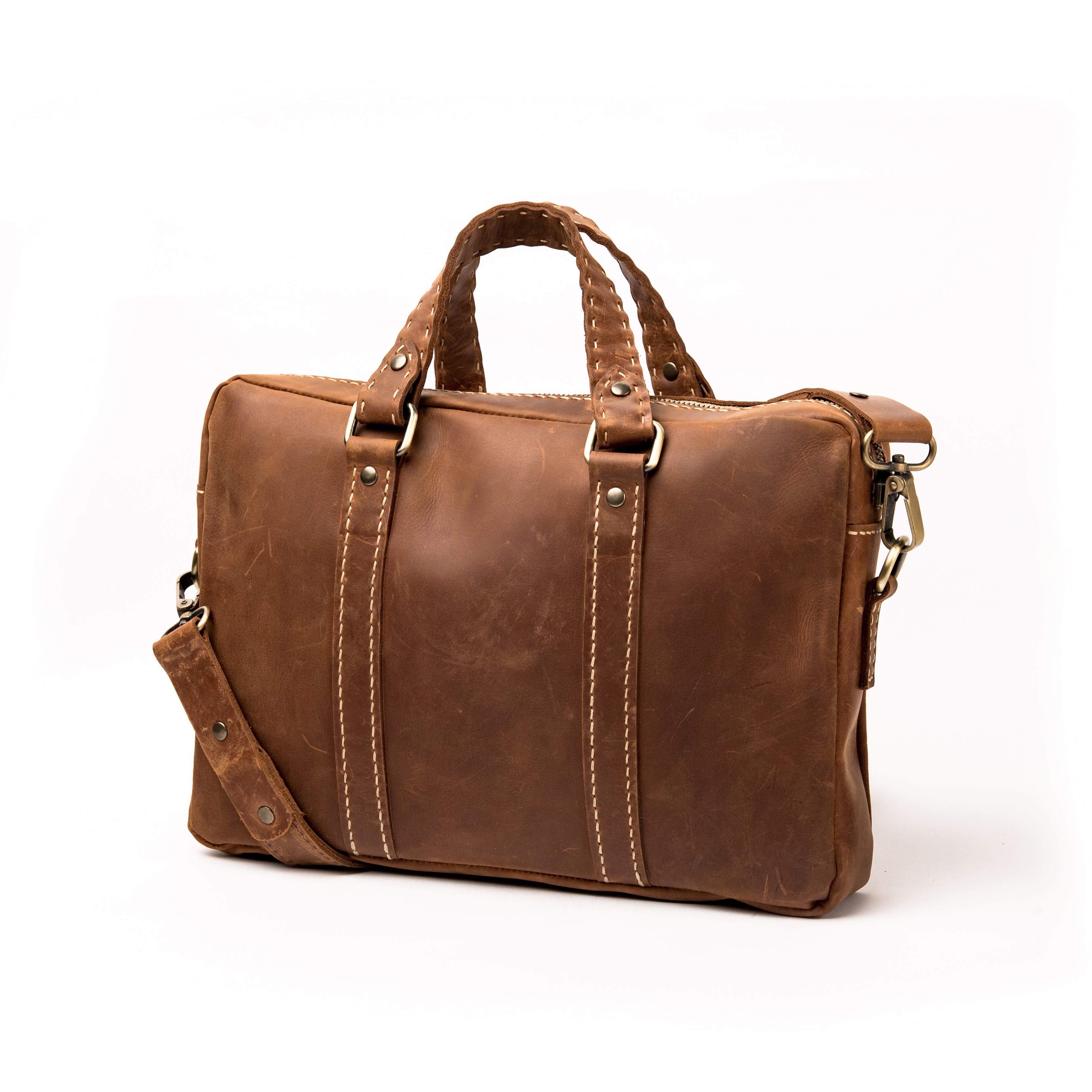 Clean view of Lionell "The Mini Brief" showing vintage brown leather texture and handwoven handles.