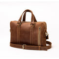 Lionell "The Mini Brief" handmade leather bag featuring a vertical zipper pocket and braided top handles.